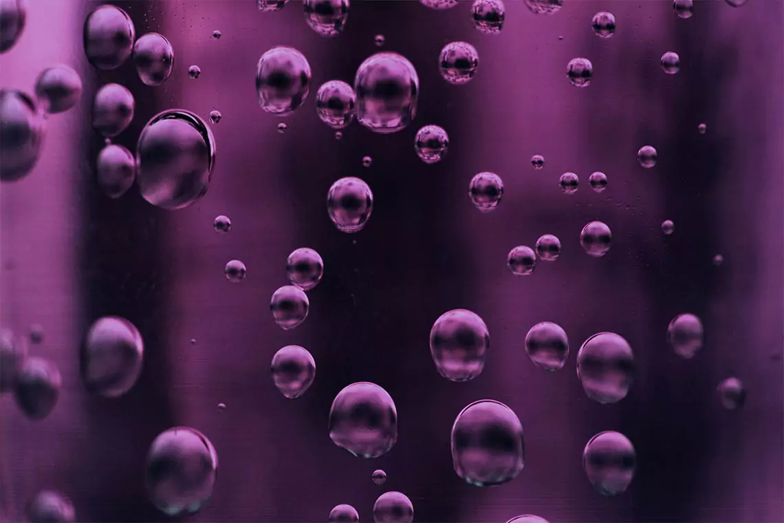 Purple liquid with bubbles inside.