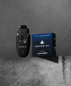 imperial-pdp-thca-vape-pod-acaiberry-img1 Imperial extraction thca liquid diamond vape pen Acai berry sitting on a concrete ledge with an imperial pod battery