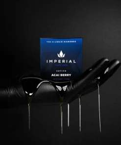 imperial-pdp-thca-vape-pod-acaiberry-img2 Imperial extraction thca liquid diamond vape pen acai berry being held in a hand with oil dripping