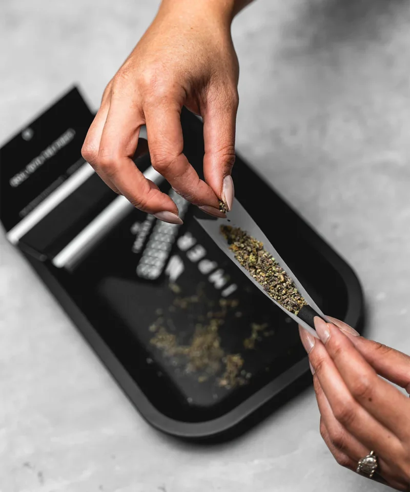 Imperial Extraction rolling paper with grinded thca flower filling the rolling paper.