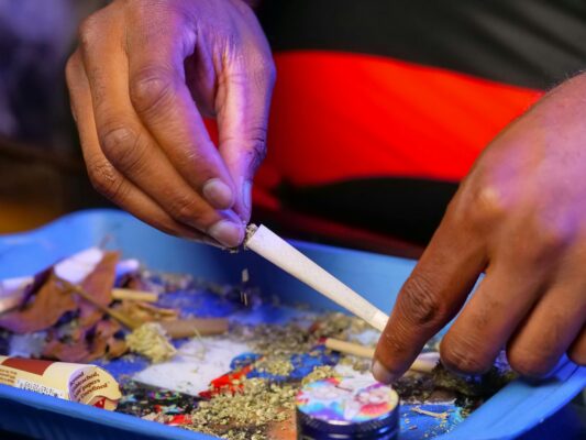 Person making a weed joint